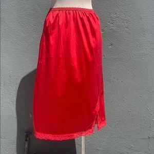 Bright red vintage slip lingerie under skirt